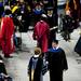 Michigan graduates receive their degree and shake hands with President Mary Sue Coleman on Sunday. Daniel Brenner I AnnArbor.com